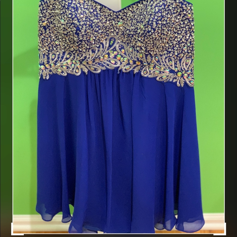 Beautiful blue dress with tears stone.